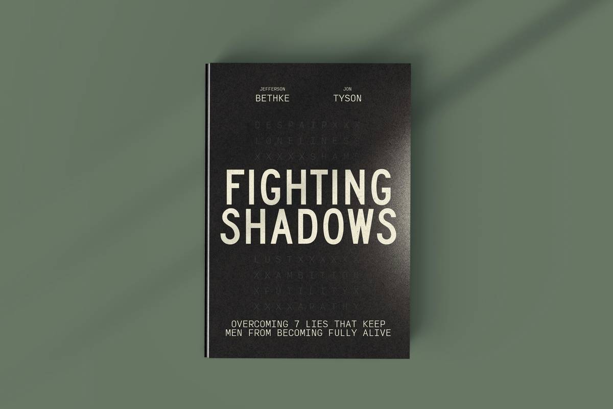 Stack of open psychological thriller books pdf on a dimly lit desk with gaming headset nearby